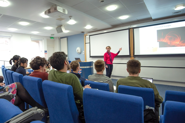 Lecturer teaching in lecture theatre